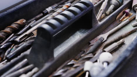 Pull-Focus-View-Of-Workmans-Tools-In-Toolbox-Viewed-From-Above