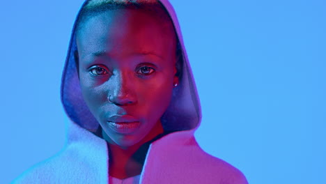 close-up portrait of a sad beautiful young black woman staring into the camera