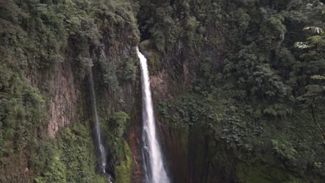 the powerful and majestic catarata del toro, a spectacular waterfall plunging from a great height into a volcanic crater