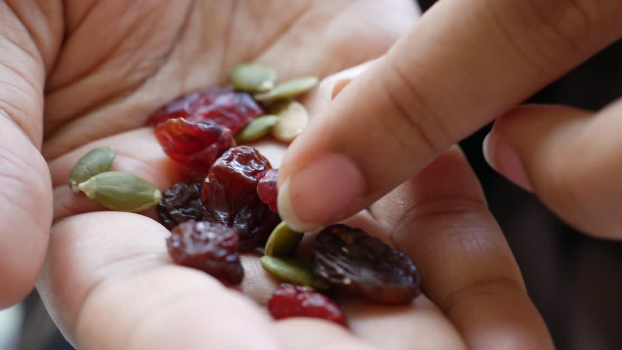 Hand pick raisin close up ,