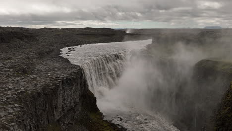 iceland detifoss powerful waterfall aerial shot cloudy day