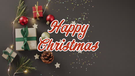 animación de saludos de navidad texto sobre bolos de navidad y regalos.