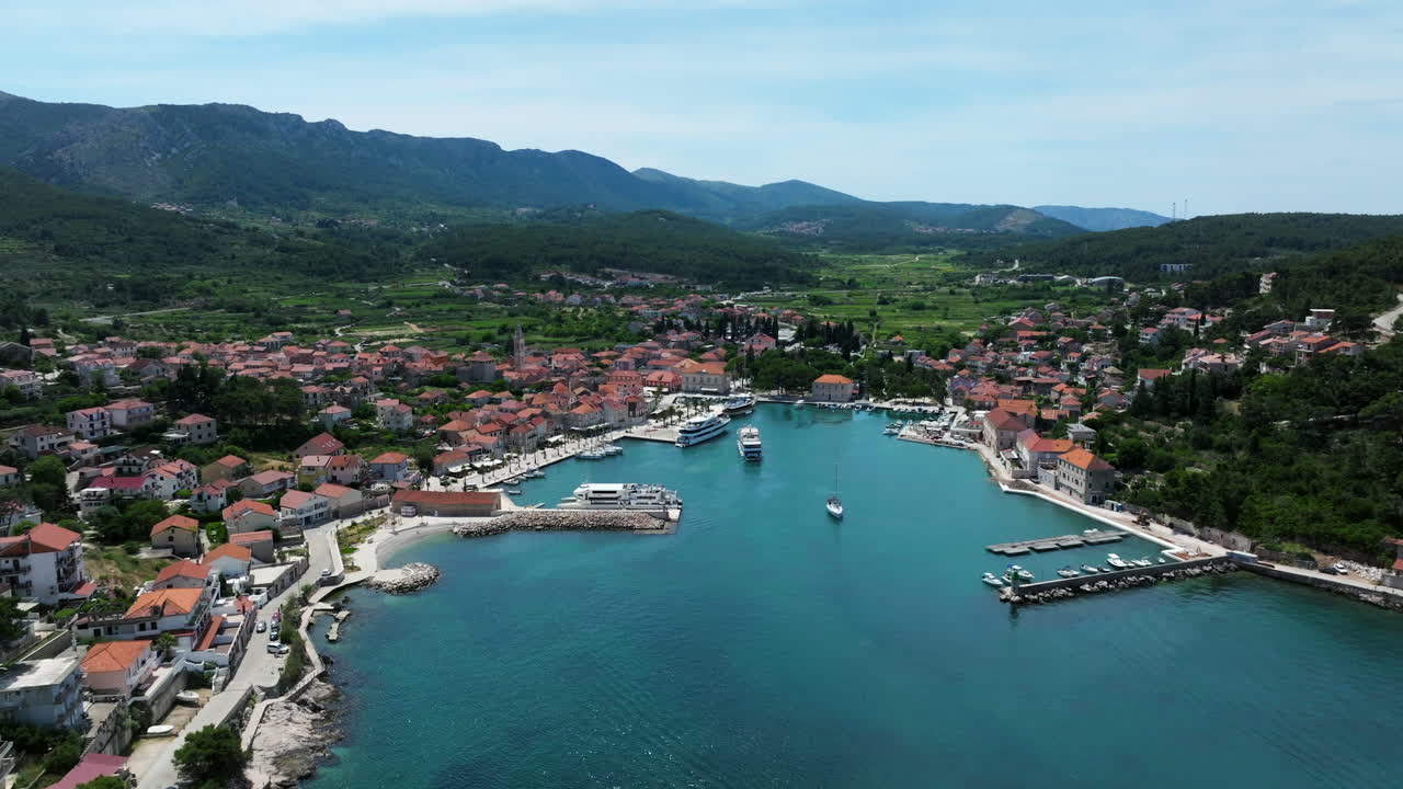 A Vista Of Jelsa Seaside Little Town In The Middle Of Hvar Island, Croatia. Aerial Drone Shot