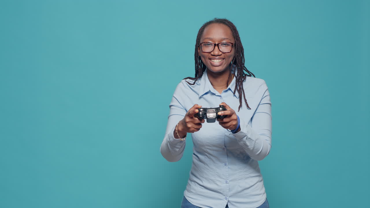 African american woman playing video games with controller