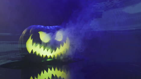 glowing jack-o''-lantern with smoke animation over dark background