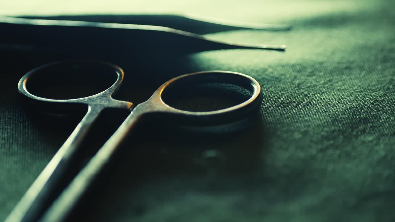 Surgical medical instruments layout revealed in slide shot CLOSE-UP