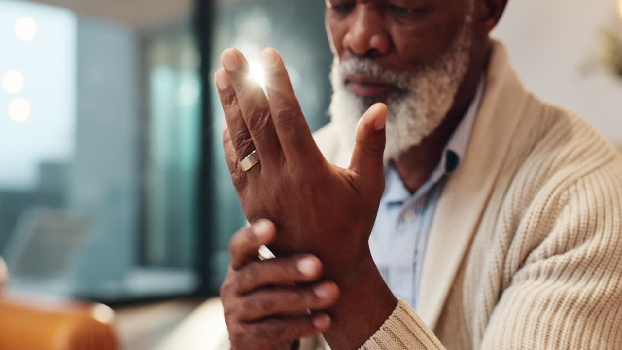 Mature man experiencing hand pain