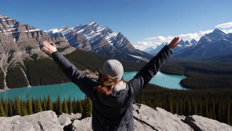 woman enjoying the view of maligne lake in the canadian rockies