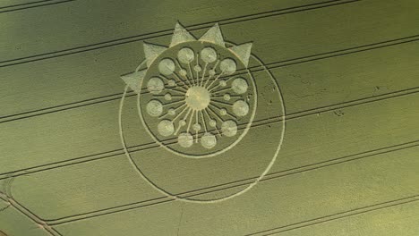 high angle aerial over crop circle in green farm land, owslebury, hampshire