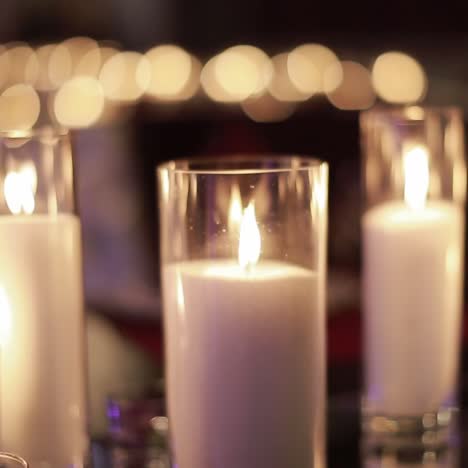 decorative candles burning on a banquet table