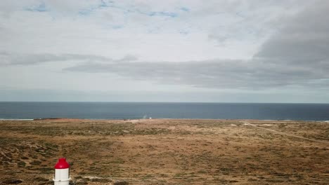 Flying-Over-White-Lighthouse-Towards-Coastline,-Australia