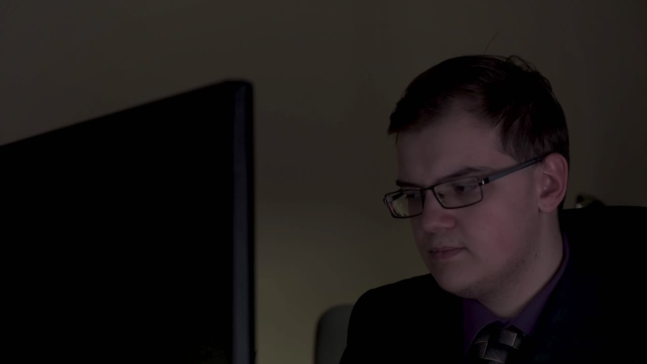Man working late at night on computer