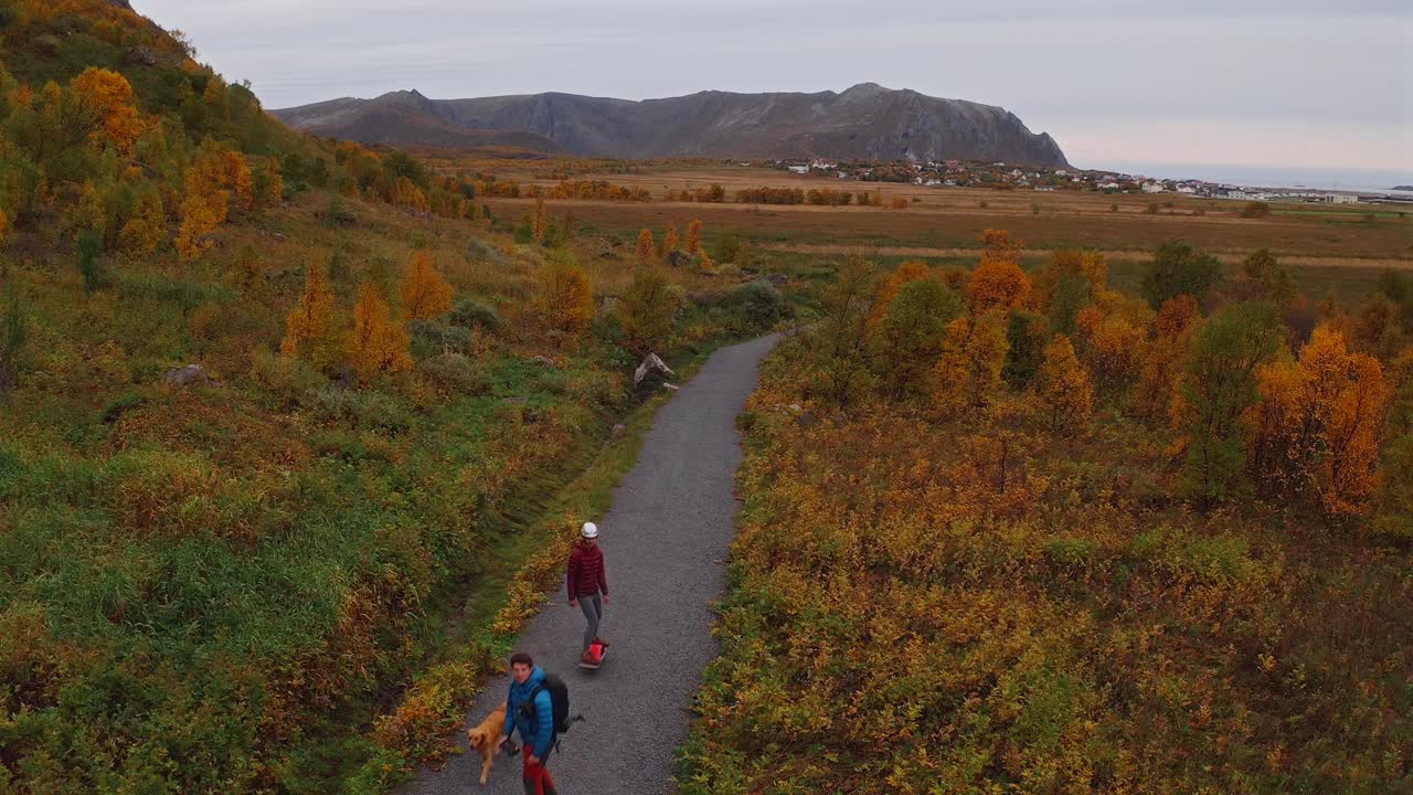 Driving through colorful autumn landscape with mountains and greenery in Vestarelen