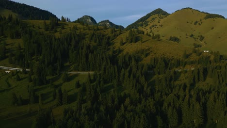 Cinematic-Bavarian-Austrian-Sudelfeld-Wendelstein-alps-mountain-peaks-with-romantic-and-idyllic-green-grass-meadows-and-panorama-view-road