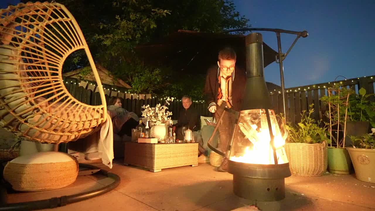 Garden furniture, friendship family nighttime scene, warming firepit