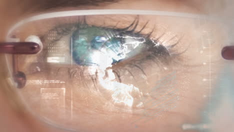 animation of data processing over blue eye of caucasian woman