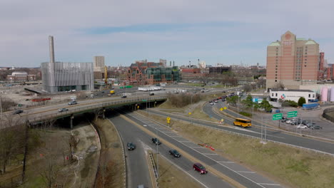 Busy-roads-in-city.-Forwards-fly-above-multilevel-interchange.-Queue-of-slowly-moving-cars-on-exit-ramps.-Boston,-USA