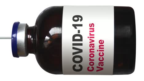 covid vaccination syringe being filled