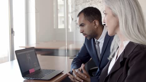 friendly colleagues talking via video call