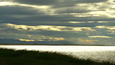 timelaps of the weather moving by a lake.