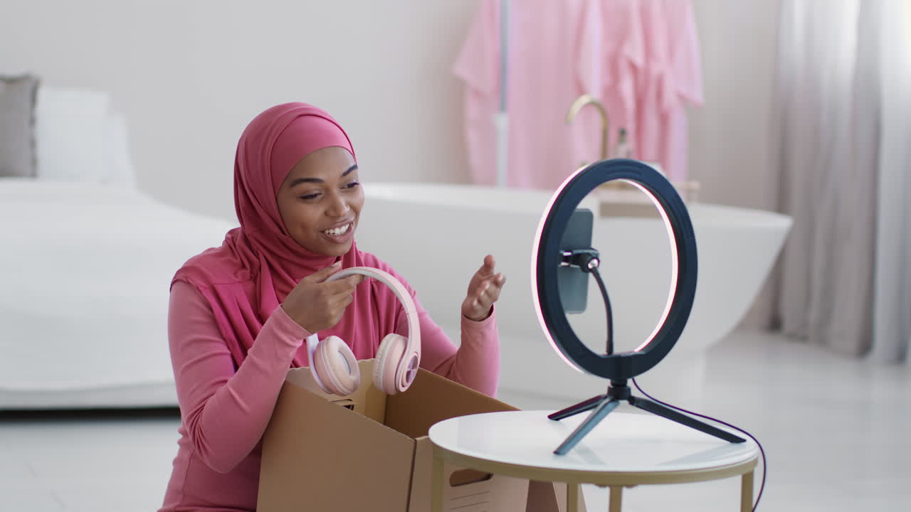 Woman Unboxing Headphones on Social Media