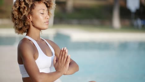 woman sitting in meditating position