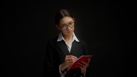 business woman does not like what is written, she crosses everything out.