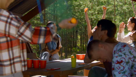 friends having fun at a picnic in the forest