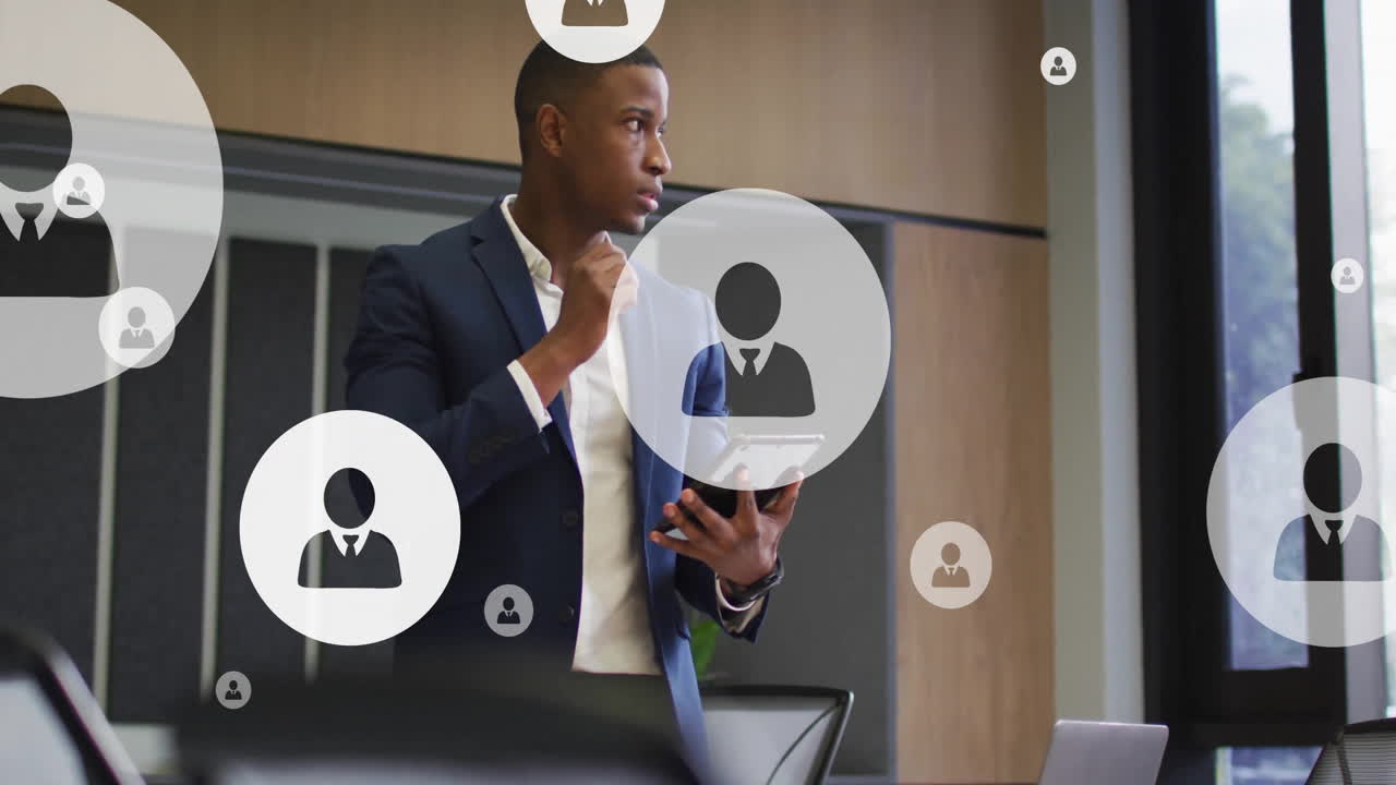 Animation of network of people icons over african american businessman in office