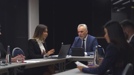 the business people sit at the table and discuss something