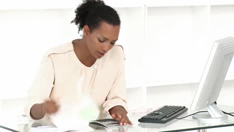 Ethnic woman stressed with so many bills to pay