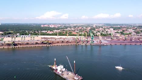 industrial part of klaipeda harbor and city skyline in aerial view