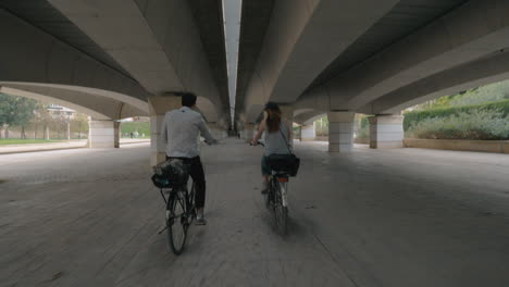 cycling under a bridge