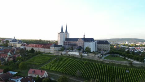 drone video from monastery michelsberg in bamberg with vineyard in the foreground