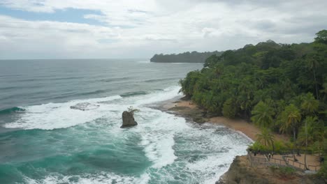 wild natural coastline in caribbean with powerful waves breaking on shore