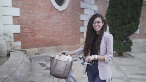 young woman on a vintage bicycle in the city