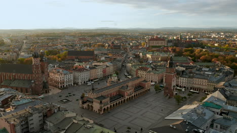 Panorama-of-soft-lighted-Main-Square-in-Krakow,-Old-Town-and-Wawel-Royal-Castle-at-beautiful-morning,-Krakow,-Poland