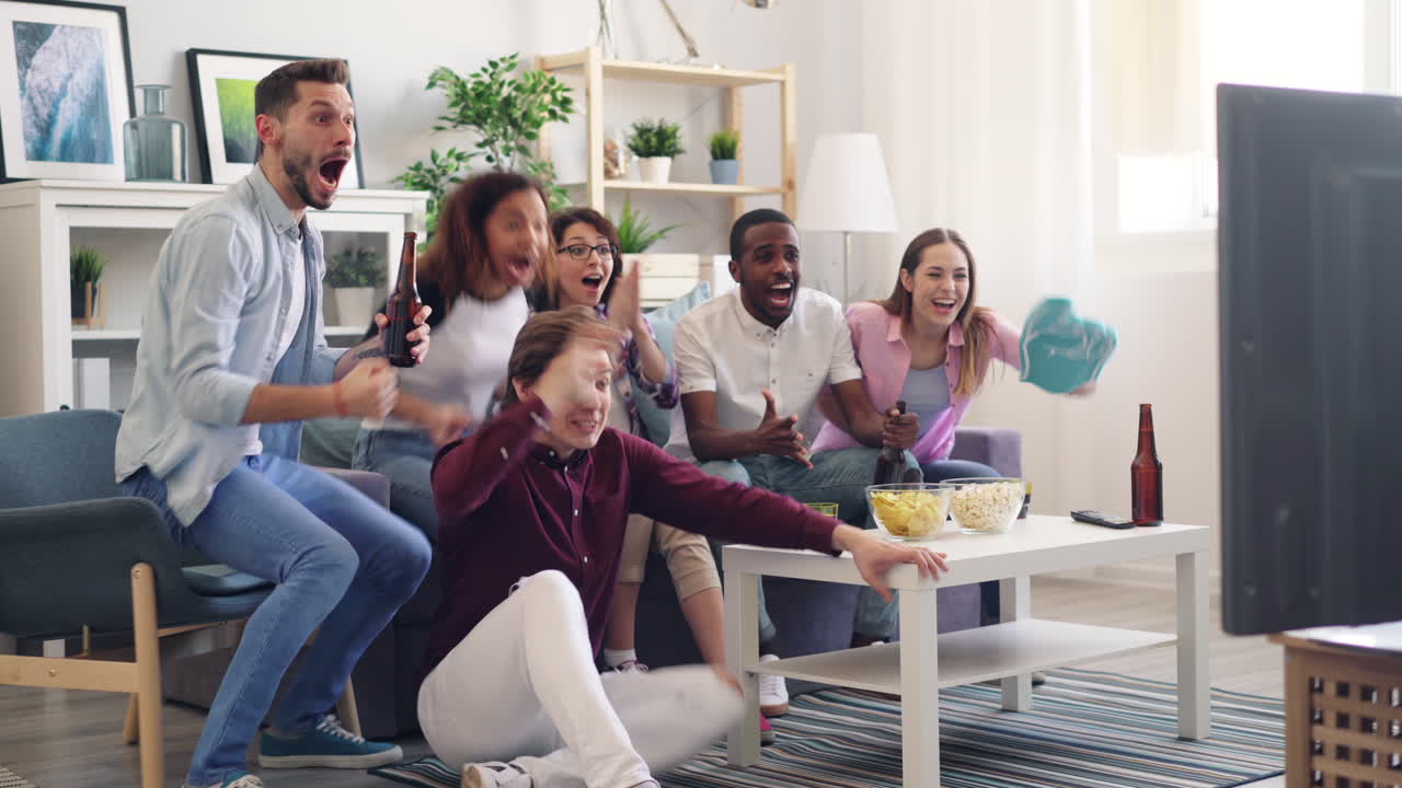 Friends Watching TV and Celebrating