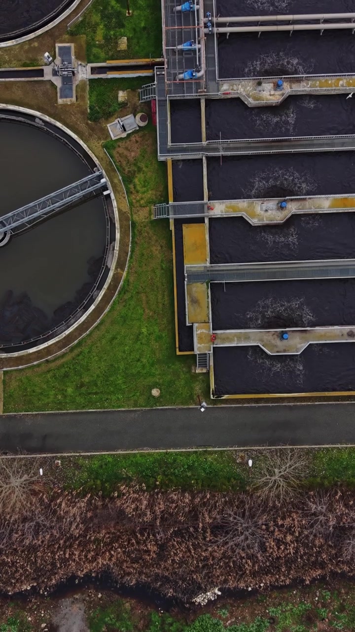 View of water treatment facility and surrounding landscape in urban area