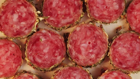 Mix of spanish pork sausages, Cutting board of appetizing catalonian snack - fuet, jamon, chorizo, olives, supermarket tapas food in spain, traditional cuisine.