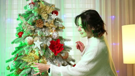 decorated christmas tree celebration. a person admires a beautifully adorned christmas tree with bright ornaments and lights in a cozy indoor setting