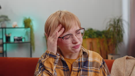 displeased young woman rubbing temples to cure headache problem suffering from migraine stress