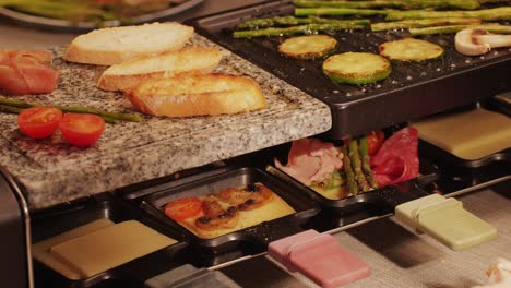 french swiss or spanish restaurant with traditional tapas food, spanish cuisine, delicious tapas and cheese plate, bruschetta with cheese, olives dry tomatoes and tasty sandwich bar appetizer, buffet