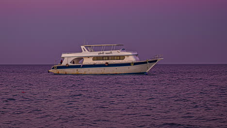 timelapse of the boat anchored at sunset in hurghada, egypt