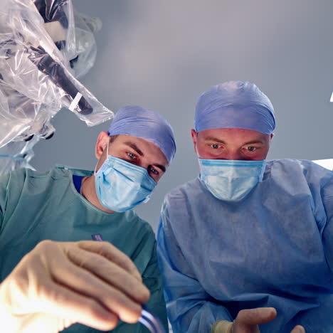 surgeons working in operating room.