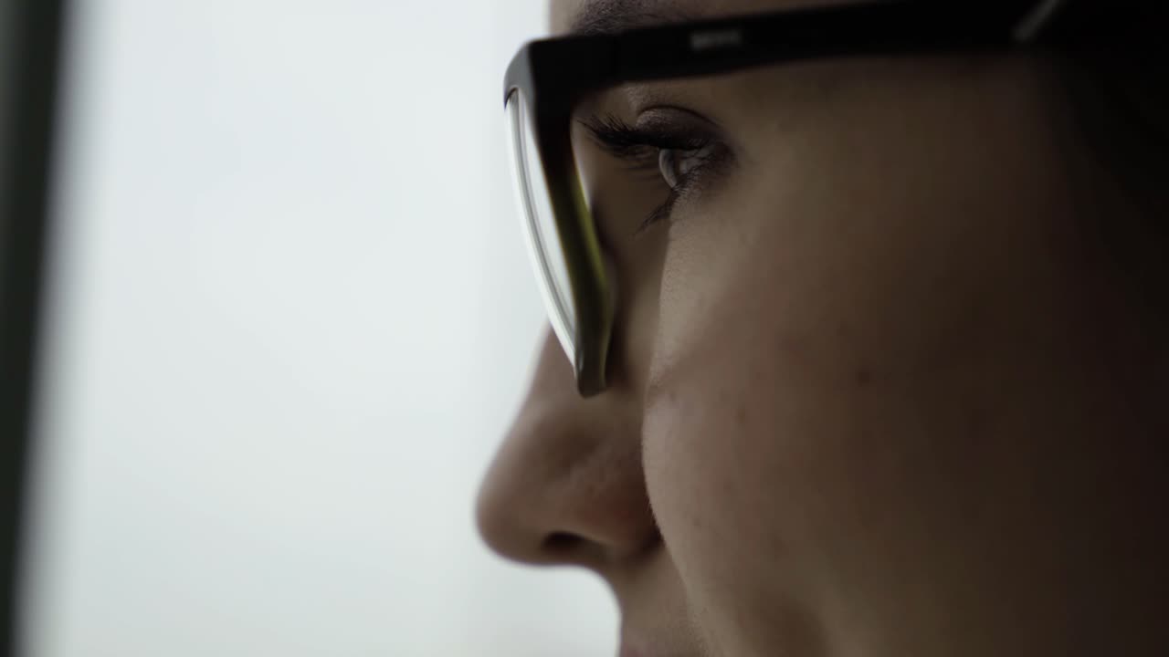 Woman Looking Out a Window