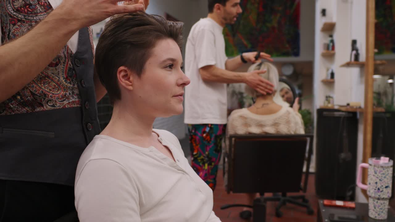 Woman getting a haircut at a hair salon