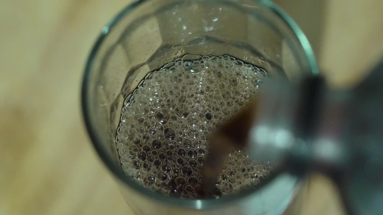 Close Up Top Down Shot of Soda Being Poured into Glass