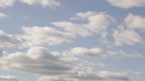 Close-up-panning-shot-of-a-bright-cloudy-sky-at-golden-hour