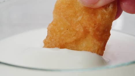 fried chicken nuggets dipping in milk